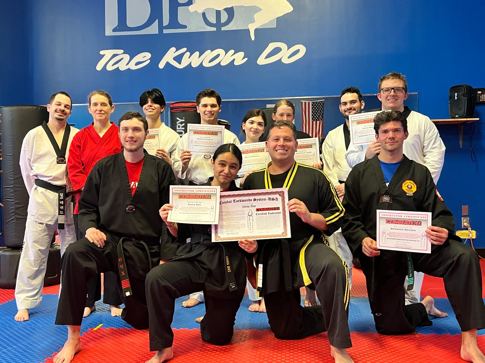 Siona with instructors and fellow martial artists following a training milestone.